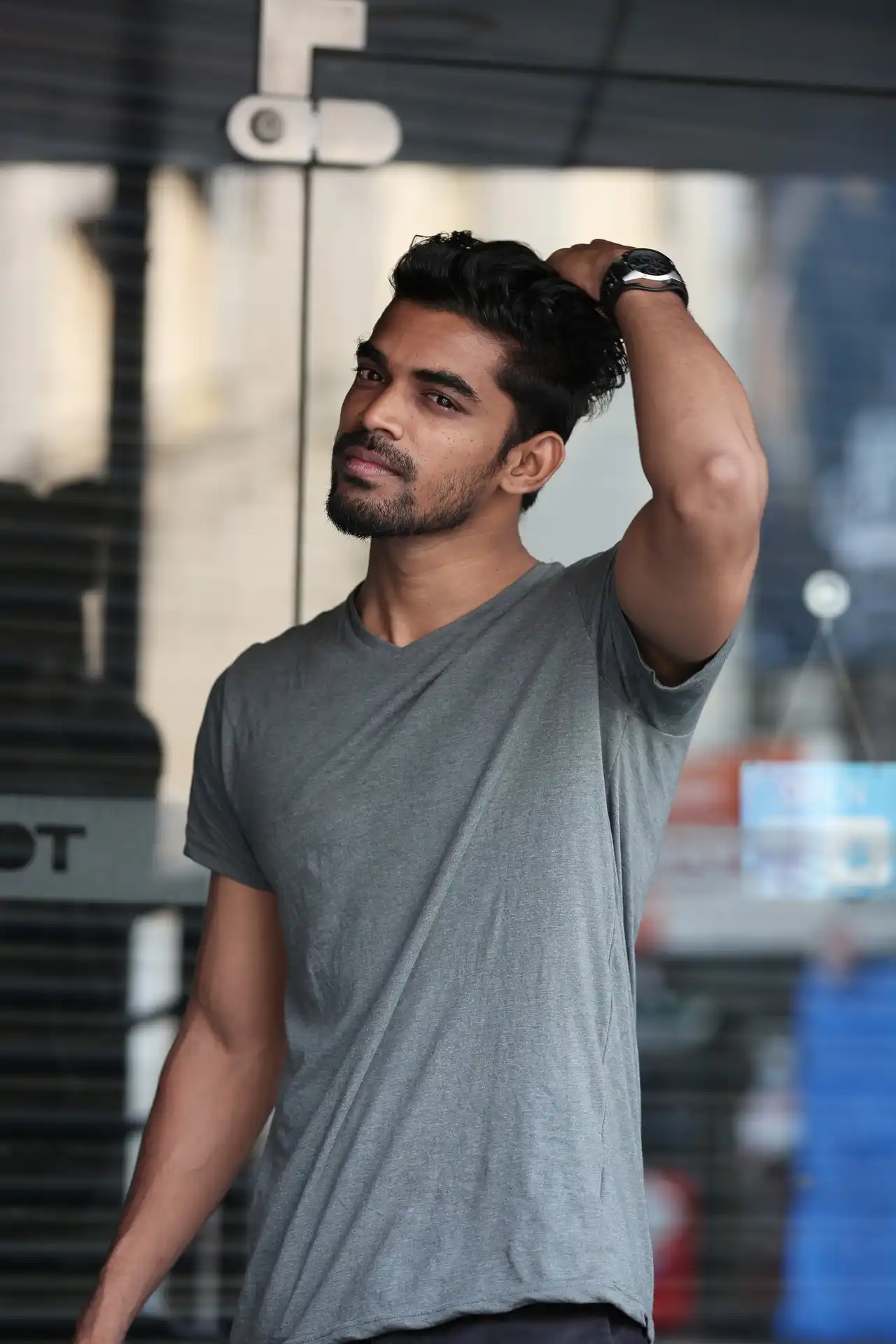 Photo of a man wearing gray shirt